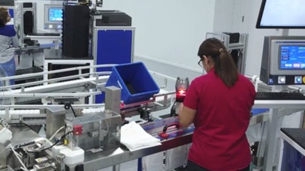 McKesson employee at a factory workstation