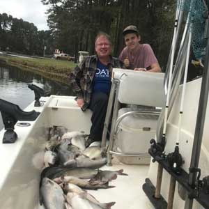Terry on a fishing trip with his son.