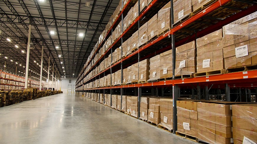 Interior of Louisville warehouse showing boxes of vaccines on shelves Interior of McKesson warehouse in Louisville showing aisles full of boxes