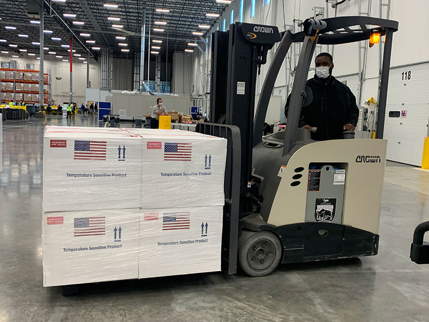 Employee in Mexico driving forklift Employee working in warehouse driving forklift