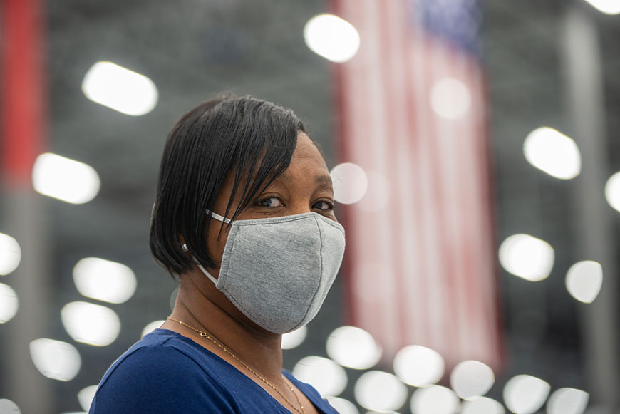 Close up of employee wearing a face mask Close up of employee wearing a face mask