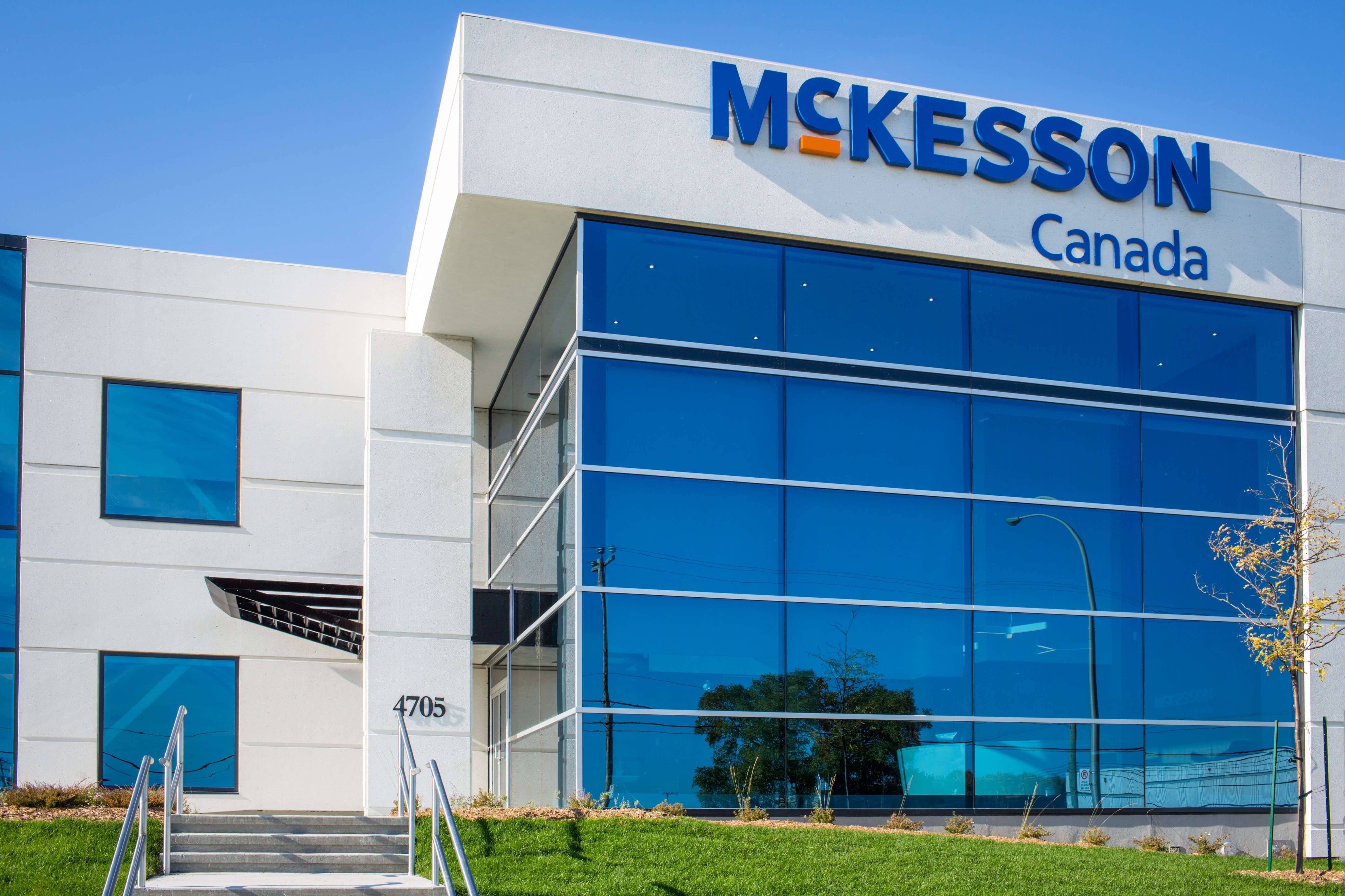 McKesson Canada office building with blue glass windows and McKesson logo on a sunny day.
