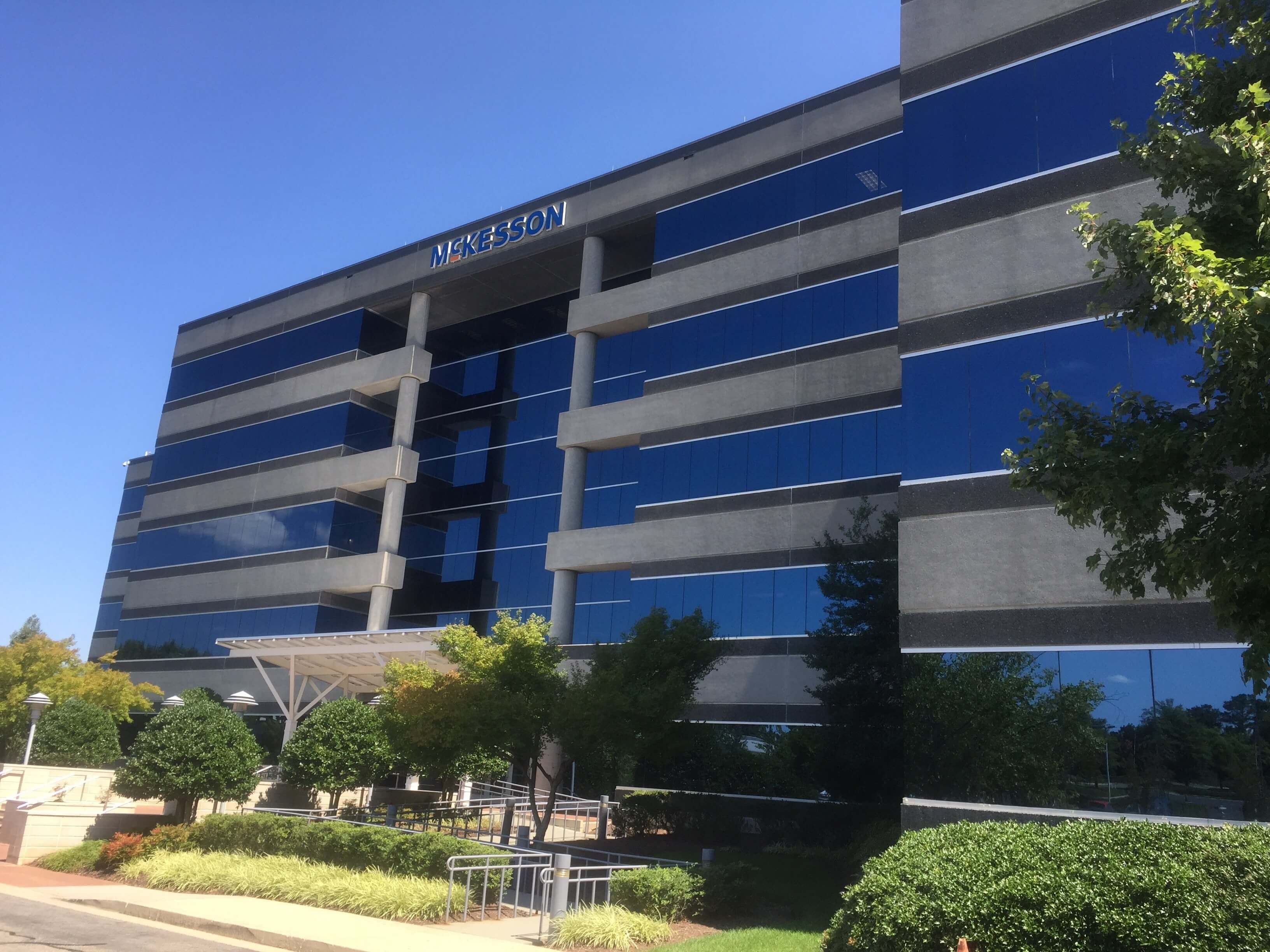 The image shows the McKesson corporate building with the logo "MCKESSON" prominently displayed at the top.