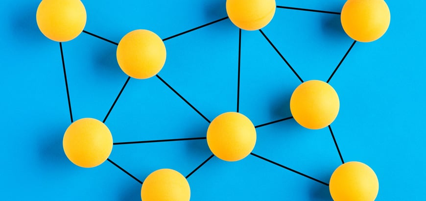 Yellow spheres connected by black lines form a network pattern on a blue background.