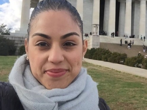 <span>Cathy Reinoso</span> stands in front of a monument in Washington DC
