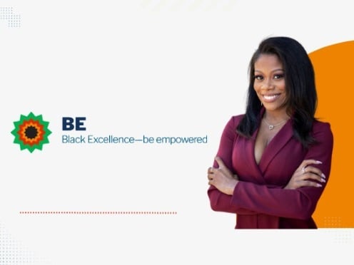 The BE ERG Logo with two employees smiling