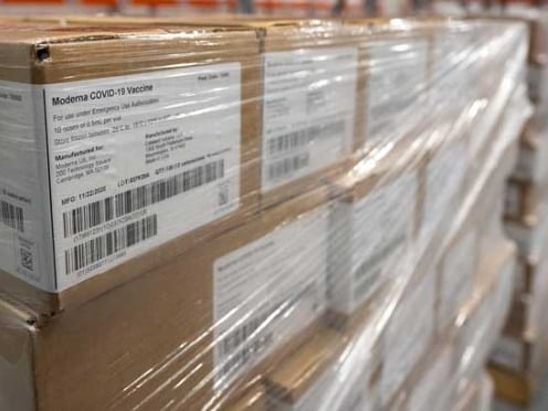 A plastic wrapped pallet of Moderna COVID-19 vaccination boxes