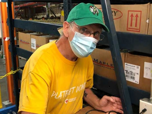 A man operating a forklift in a McKesson distribution center