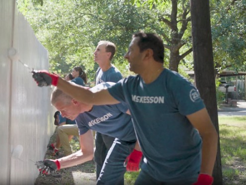 People painting a wall