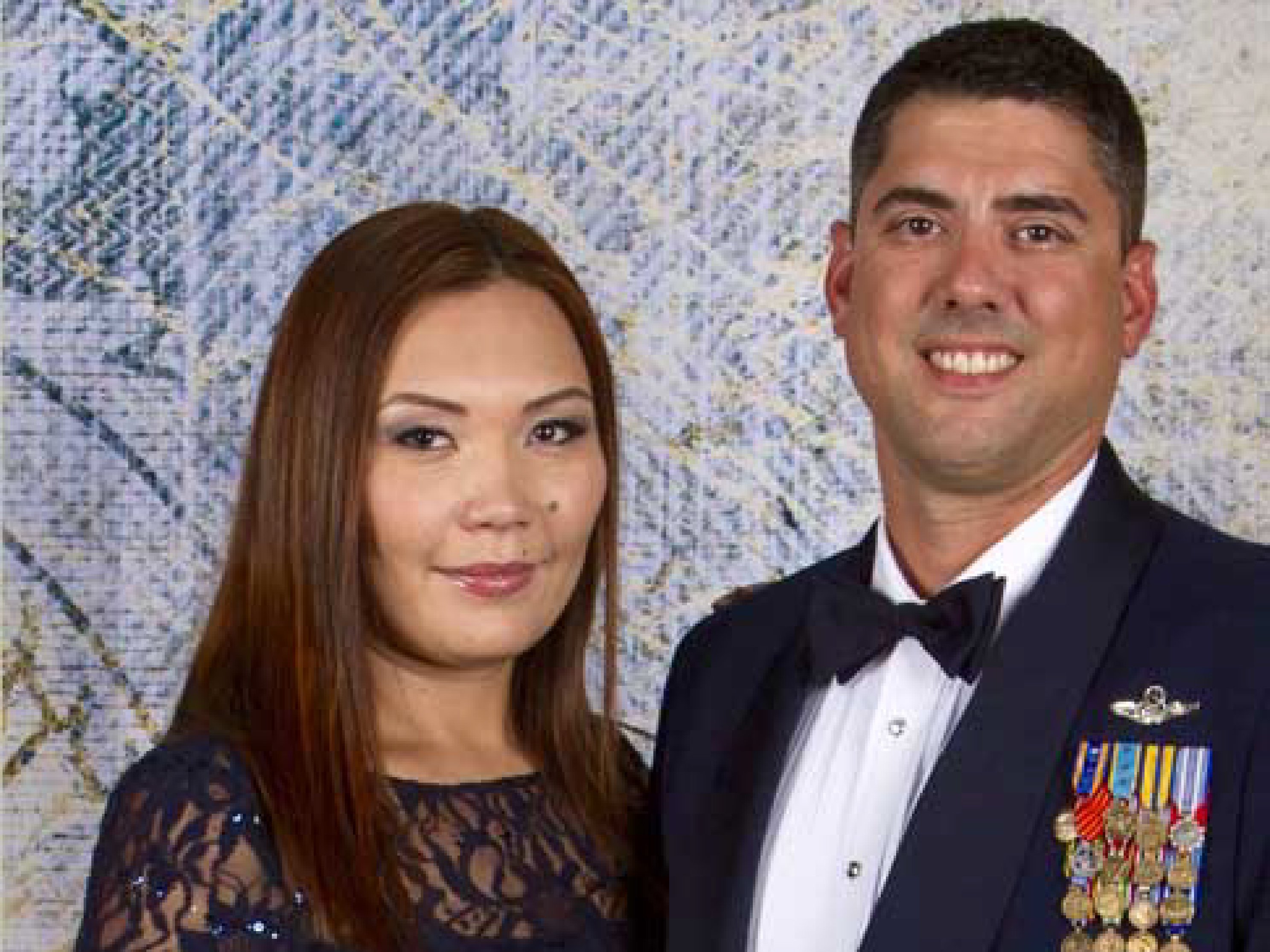 The logo for McKesson Military Resource Group next to an image of Ryan Crumrine and his wife