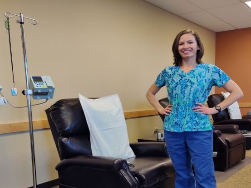 <span>Leslie Dehoyos standing in a hospital room<br>  </span>
